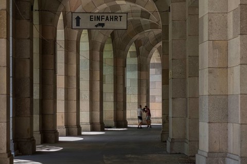 Two men boxing in the arcade of the Congress Hall, unfinished National Socialist monumental