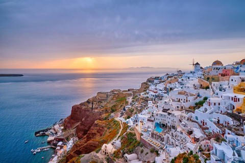 Famous greek iconic selfie spot tourist destination Oia village with traditional white houses and