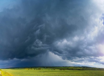 Thunderstorm cell with rainbow over fields near Krebs in the Osterzgebirge, Krebs, Saxony, Germany,