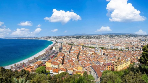 France, panoramic skyline of old historic Nice center and azure beaches along Promenade des