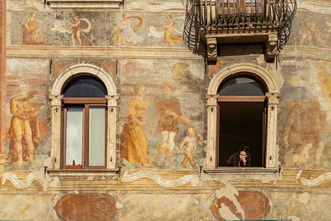 The painted façade of the Case Cazuffi Rella houses on Piazza del Duomo in Trento, Trentino, Italy,