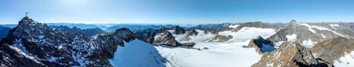 Panorama at the summit of the Wilder Freiger with summit cross and with glacier Übeltalferner and