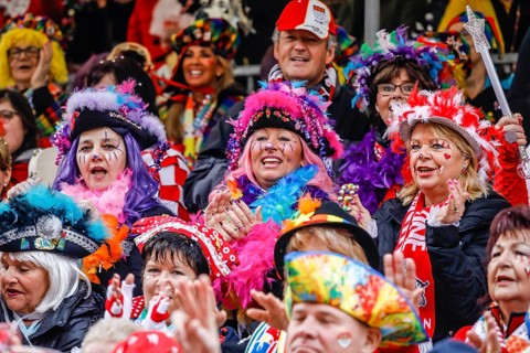 Colourfully costumed carnivalists celebrate carnival in Cologne, on Weiberfastnacht the street
