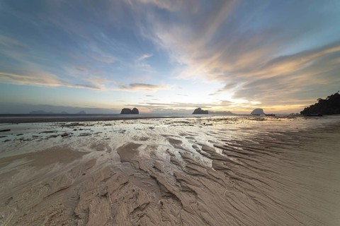 Structures in the sand, sunrise at low tide on the beach of Koh Ngai Island, Andaman Sea, Satun