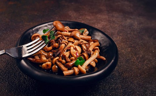 Pickled honey mushrooms, in a bowl, homemade, top view, no people