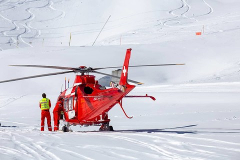 25 March 2024, Grindelwald, Switzerland: Rescue helicopter in action after a skiing accident