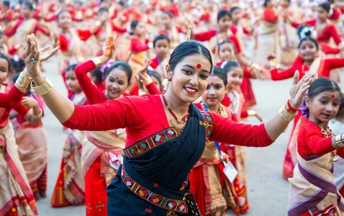Participants with an instructor dance on the final day of a Bihu dance workshop ahead of Rongali