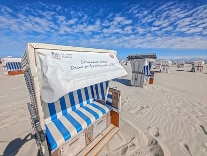 Preparing for the high season on the beach, setting up the beach chairs, North Sea, on the edge of