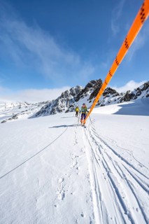 Ski tourer with rope, rope team on the Vadret da Porchabella glacier on the ascent to the summit of