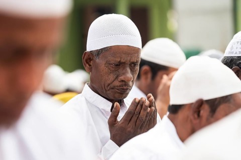 KAYAKUCHI, INDIA - MARCH 31: Muslims perform Eid al-Fitr prayer at Eidgah in Kayakuchi, India on