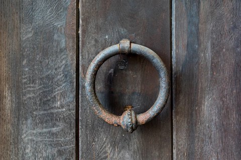 Door knocker as a ring at the Romanesque Basilica of the Holy Cross in Wechselburg, Saxony,