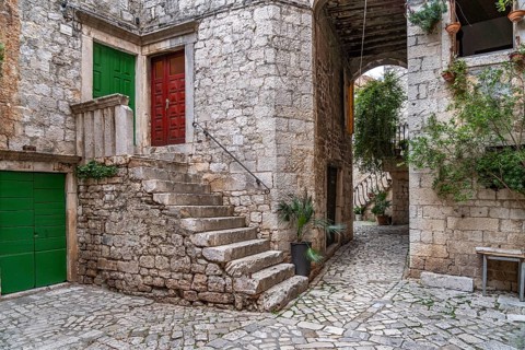 Narrow alley in the old town centre of Trogir, Croatia, Europe