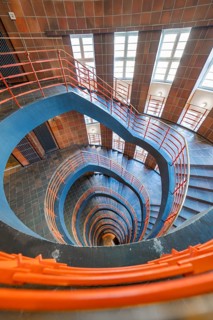 Wide-angle shot of a spiral staircase with red banisters, SPRINKENHOF, Hamburg, Germany, Europe