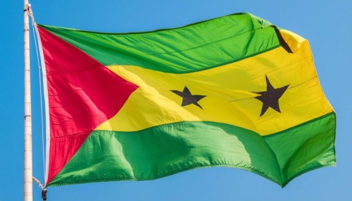 The flag of the Democratic Republic of Sao Tome, Africa, flutters in the wind, isolated against a