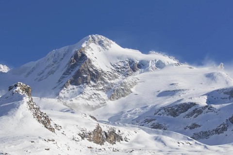 Snow covered mountaintop, pinnacle of the Gran Paradiso mountain in winter in the Gran Paradiso