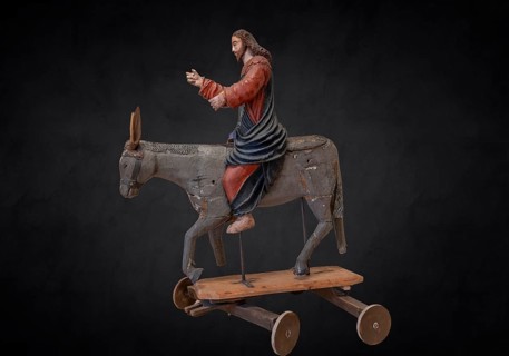 Christ on the palm donkey, on a dark background, wooden figure from around 1400, Museum Bezau,