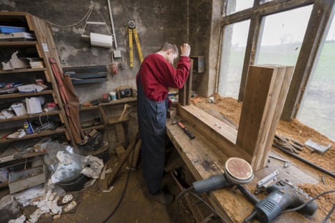Young man builds a table in his workshop, Mecklenburg-Vorpommern, Germany, Europe