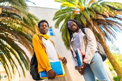African american university students standing proud smiling at camera in the campus