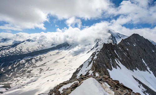 View of snow-covered mountain landscape with glaciated summit Großer Möseler and glacier