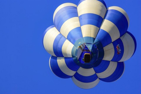 Rising hot air balloon with passengers on board, as part of the aviation festival on the Rossfeld
