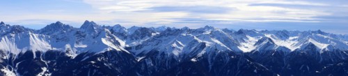 Alpine panorama with snow-covered mountain peaks in winter. Taken in the ski resort of Serfaus Fiss