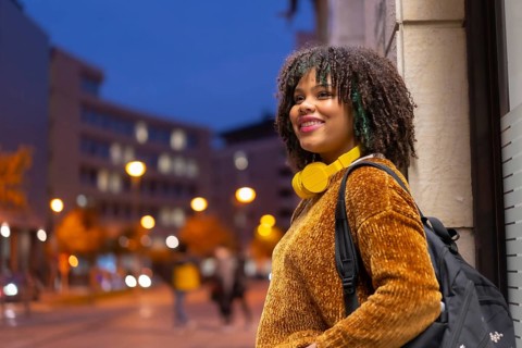 Portrait of black ethnic girl in the early morning going to the university on the way back to
