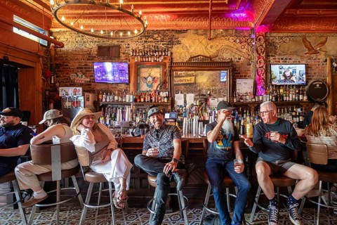 New Orleans, Louisiana - People at the bar drink and listen to music at Bamboula's music club on