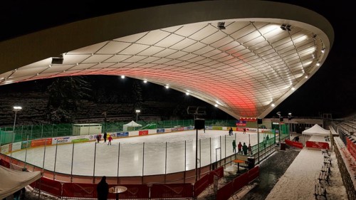Tourists on ice rink, ice sports stadium, ice skating in the evening, Schierker Feuerstein Arena,