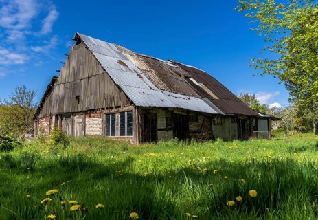 Abandoned and derelict farmhouses on undeveloped land in Rügen, Mecklenburg-Vorpommern, Germany,