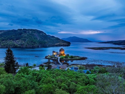 Night over Eilean Donan Castle and Loch Duich from a drone, Isle of Skye, Highlands, Scotland,