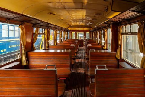 Passenger carriage with wooden benches at Stoomtrein Maldegem-Eeklo, heritage railway association