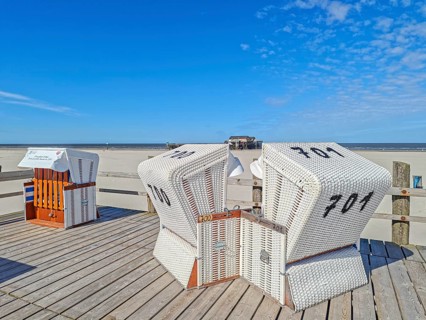 Preparing for the high season on the beach, setting up the beach chairs, North Sea, on the edge of