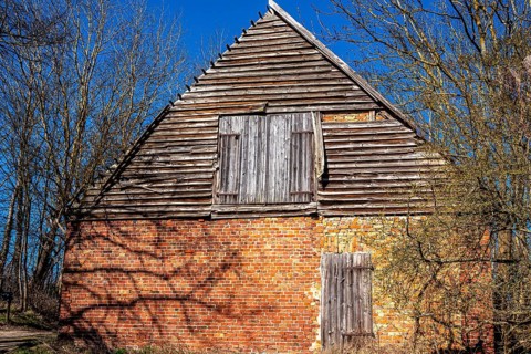 Abandoned and derelict farmhouses on undeveloped land in Rügen, Mecklenburg-Vorpommern, Germany,