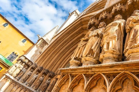 Ancient statues decorating the entrance of tarragona cathedral in spain, showcasing architectural