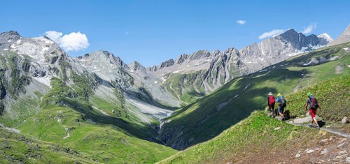 Three mountaineers on a hiking trail on the Daberlenke, view of rocky mountain peaks in the