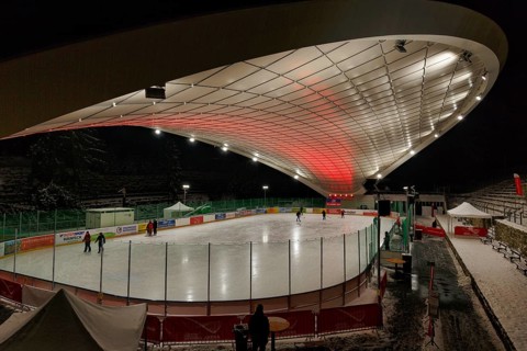 Tourists on ice rink, ice sports stadium, ice skating in the evening, Schierker Feuerstein Arena,