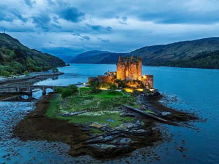Night over Eilean Donan Castle and Loch Duich from a drone, Isle of Skye, Highlands, Scotland,