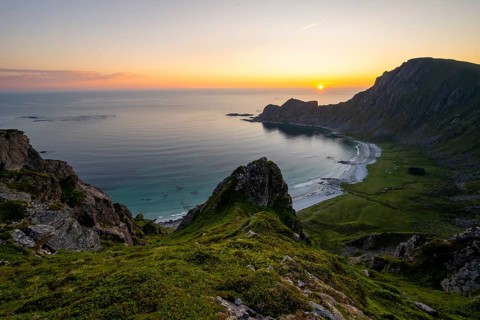 View of coastal landscape at sunset, cliffs and summit of Måtind or Måtinden, Høyvika beach and