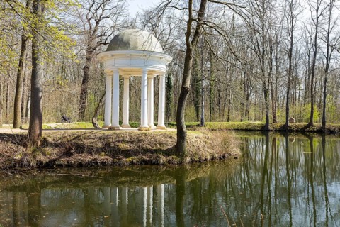 Diana Temple in Lützschena Castle Park with reflection in the water, Leipzig, Saxony, Germany,