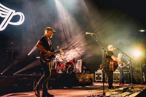 Joey Santiago (guitarist), Black Francis (singer and guitarist) and Emma Richardson (bassist) of