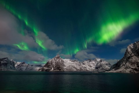 Northern Lights (Aurora Borealis) snowy mountains of the Reinfjord, Olstinden, Hamnøy, Moskenesøy,