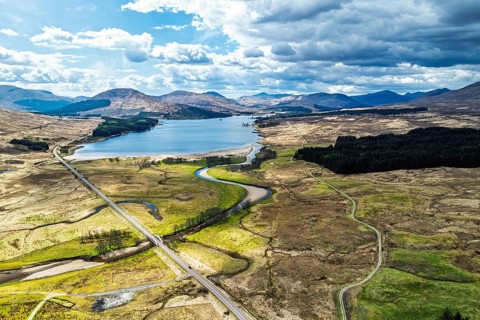 Mountains and Moors over Loch Tulla and River Orchy from a drone, Highlands, Scotland, UK