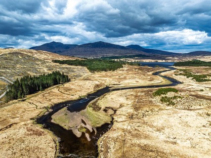 Mountains and Moors over Loch Tulla and River Orchy from a drone, Highlands, Scotland, UK