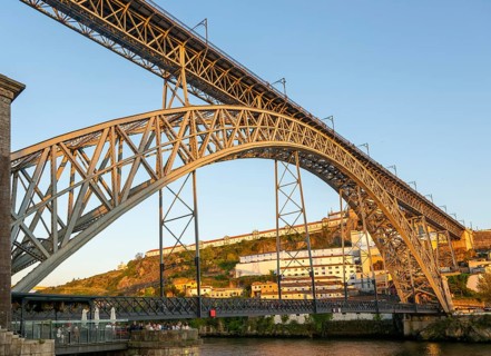 Golden hour at Dom Luis I Bridge crossing River Douro to Vila Nova de Gaia, Porto, Portugal, Europe