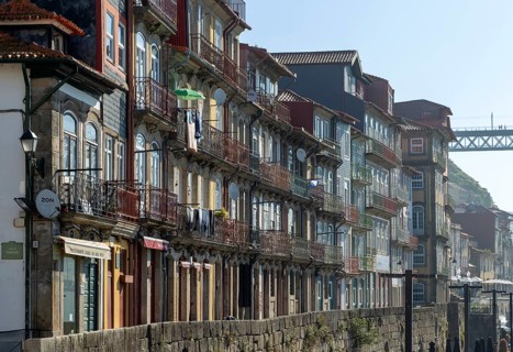 Historic buildings with balconies on waterfront of Ribeira district, city of Porto, Portugal,