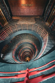 Vertical view from above through a spiral staircase in a building called Sprinkenhof, Hamburg,