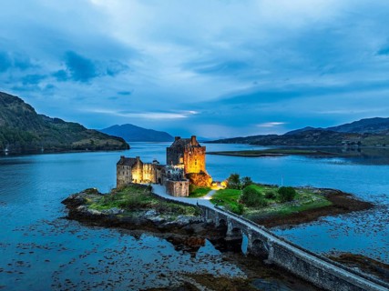 Night over Eilean Donan Castle and Loch Duich from a drone, Isle of Skye, Highlands, Scotland,