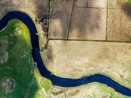 Top Down over Farms and River Dochart and Road A85 from a drone, Perthshire, Scotland, UK