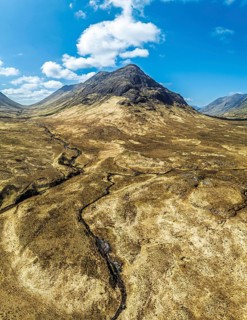 Panorama of Buachaille Etive Beag and Three Sisters in Glencoe over Moors and Road A82 from a
