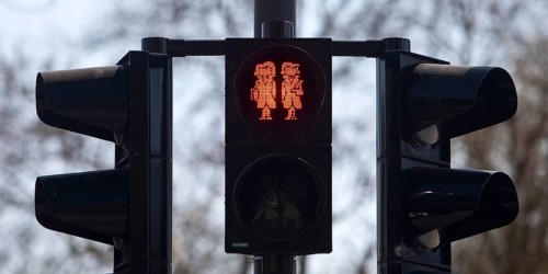 Pedestrian traffic light with red Brothers Grimm Ampelmännchen, Hanau, birthplace of the brothers,